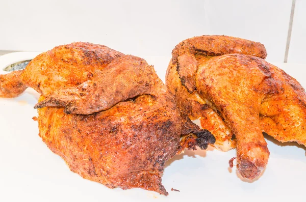 Beautiful brown grilled chicken legs on white plate. Chicken Thighs — Stock Photo, Image