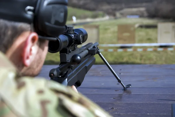 Military sniper aims at a target — Stock Photo, Image