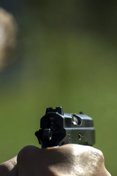 Man practicing shooting with a gun — Stock Photo, Image