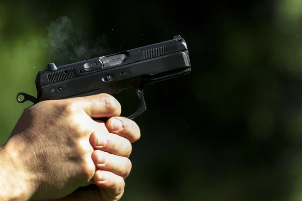 Man practicing shooting with a gun — Stock Photo, Image
