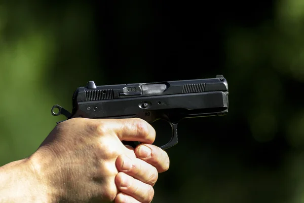 Man practicing shooting with a gun — Stock Photo, Image