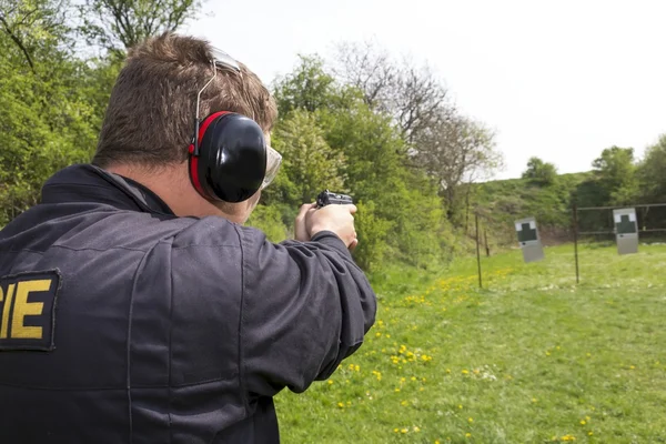 Polis podczas fotografowania praktyki — Zdjęcie stockowe