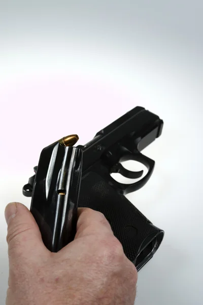 Man pointing a weapon and weapon charges — Stock Photo, Image