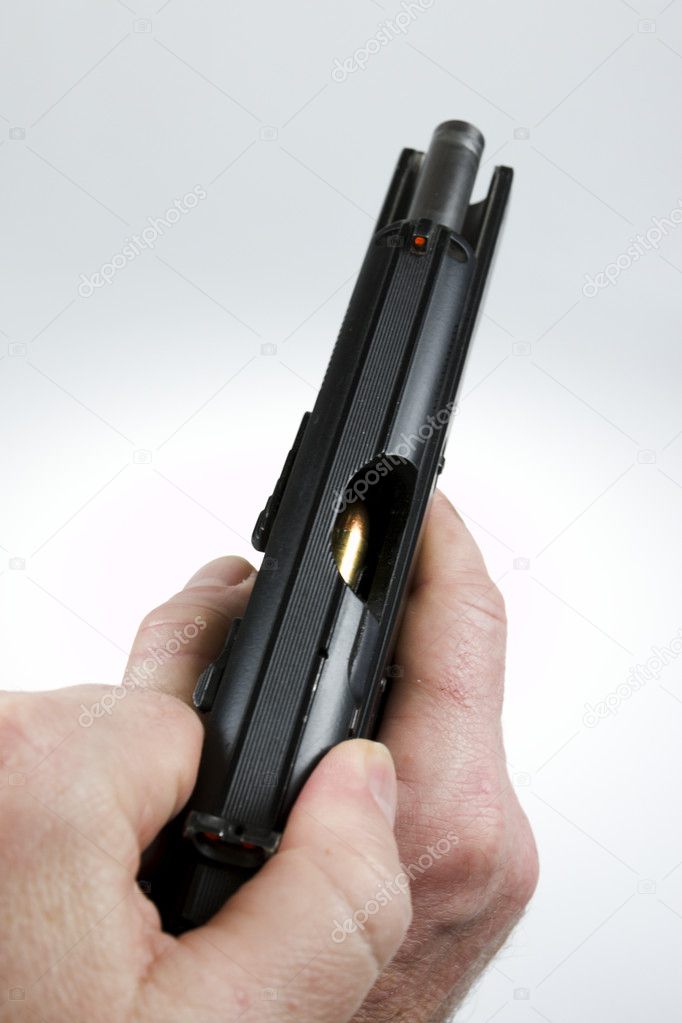 Man pointing a weapon and weapon charges Stock Photo by ©Tylinek 95651724