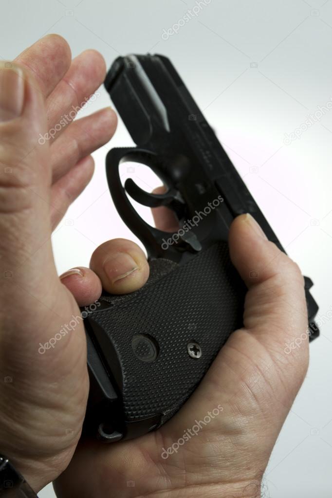 man pointing a weapon and weapon charges