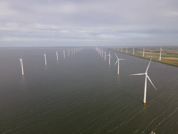 Offshore windmill park with clouds and a blue sky, windmill park in the ocean drone aerial view with wind turbine — Stock Photo, Image