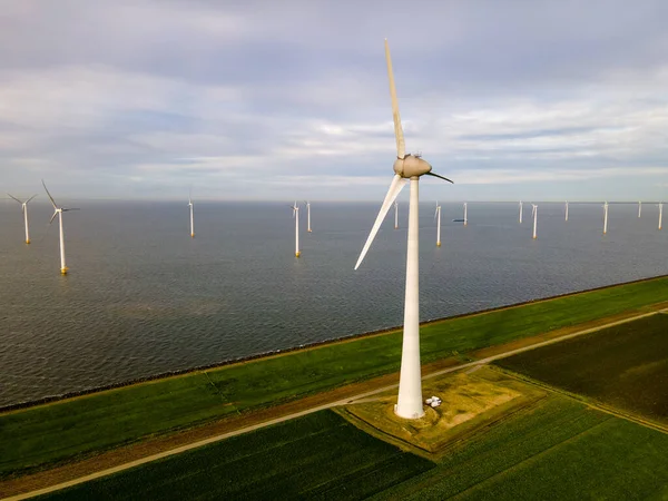 Offshore windmill park with clouds and a blue sky, windmill park in the ocean drone aerial view with wind turbine — Stock Photo, Image