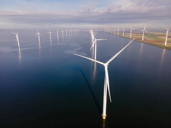 Offshore windmill park with clouds and a blue sky, windmill park in the ocean drone aerial view with wind turbine — Stock Photo, Image