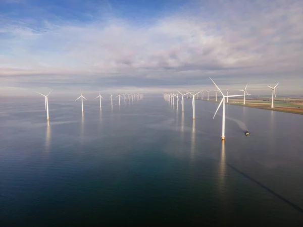 Offshore windmill park with clouds and a blue sky, windmill park in the ocean drone aerial view with wind turbine — Stock Photo, Image