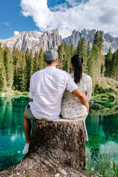 Couple mid age men and woman visiting the Italian Dolomites in Italy Lago Di Carezza — Stock Photo, Image