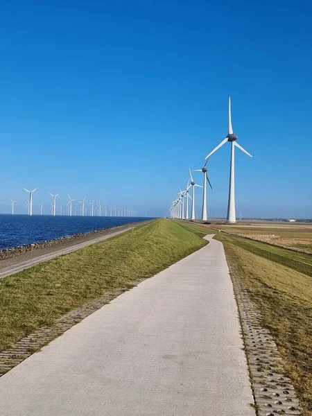 Windmill village indrustial wind mill by the lake Ijsselmeer Nehterlands