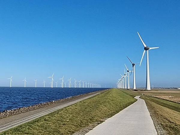 Windmill village indrustial wind mill by the lake Ijsselmeer Nehterlands