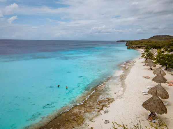 Aerial view of coast of Curacao in the Caribbean Sea with turquoise water, white sandy beach and beautiful coral reef at Playa Cas Abao — Stock Photo, Image