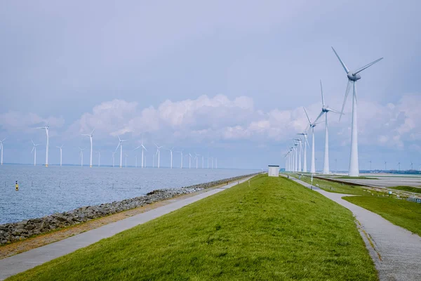 Offshore Windmill farm in the ocean Westermeerwind park , windmills isolated at sea on a beautiful bright day Netherlands Flevoland Noordoostpolder