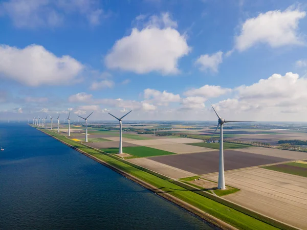Offshore windmill park with clouds and a blue sky, windmill park in the ocean drone aerial view with wind turbine Flevoland Netherlands Ijsselmeer — Stock Photo, Image