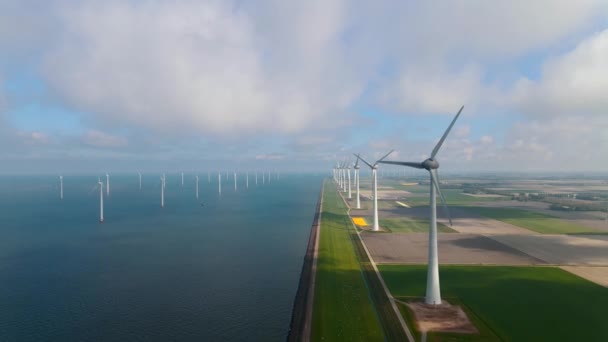 Offshore windmill park with clouds and a blue sky, windmill park in the ocean drone aerial view with wind turbine Flevoland Pays-Bas Ijsselmeer — Video