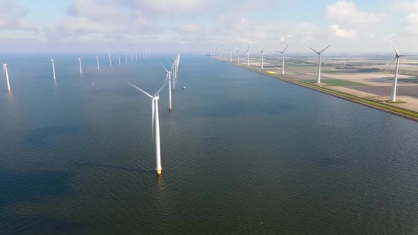 Offshore windmill park with clouds and a blue sky, windmill park in the ocean drone aerial view with wind turbine Flevoland Pays-Bas Ijsselmeer — Video