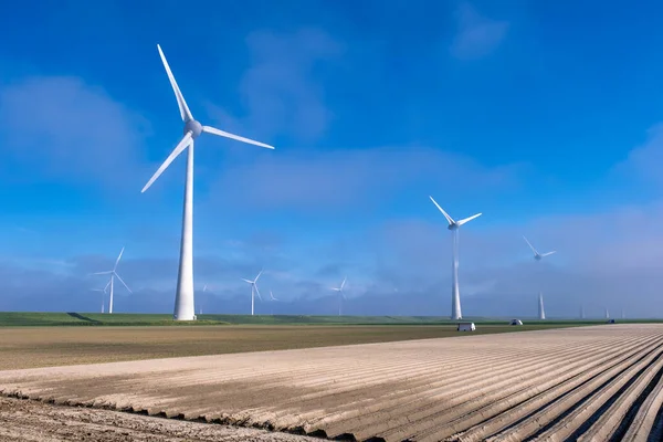 Offshore windmill park with clouds and a blue sky, windmill park in the ocean drone aerial view with wind turbine Flevoland Pays-Bas Ijsselmeer — Photo