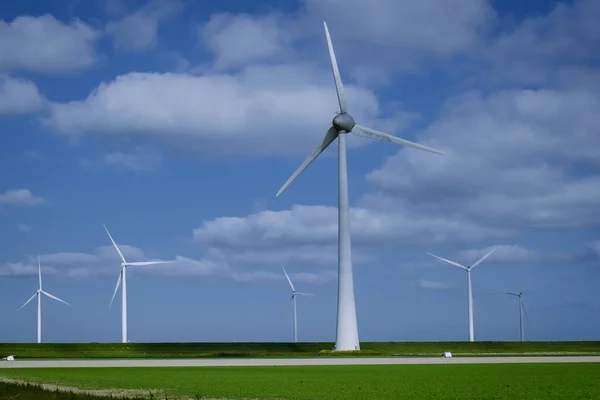 Offshore windmill park with clouds and a blue sky, windmill park in the ocean drone aerial view with wind turbine Flevoland Pays-Bas Ijsselmeer — Photo