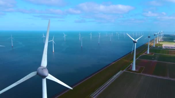 Offshore windmill park with clouds and a blue sky, windmill park in the ocean drone aerial view with wind turbine Flevoland Netherlands Ijsselmeer — Stock Video