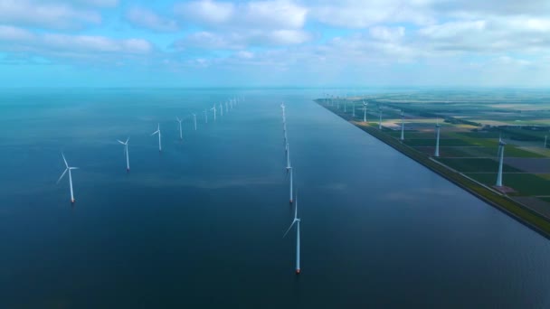 Offshore windmill park with clouds and a blue sky, windmill park in the ocean drone aerial view with wind turbine Flevoland Pays-Bas Ijsselmeer — Video