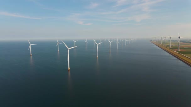 Vindturbin från luften, drönare utsikt över vindpark westermeerdijk en väderkvarn gård i sjön Ijsselmeer den största i Nederländerna, hållbar utveckling, förnybar energi — Stockvideo