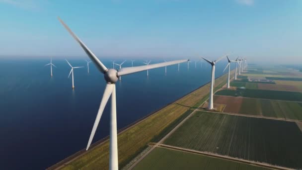 Offshore windmill park with clouds and a blue sky, windmill park in the ocean drone aerial view with wind turbine Flevoland Netherlands Ijsselmeer — Stock Video