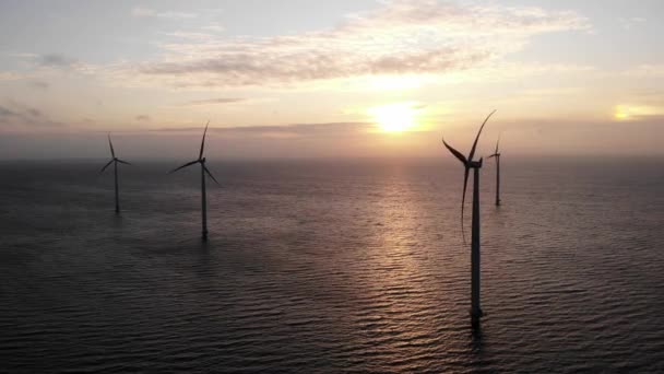 Offshore windmill park with clouds and a blue sky, windmill park in the ocean drone aerial view with wind turbine Flevoland Netherlands Ijsselmeer — Stock Video