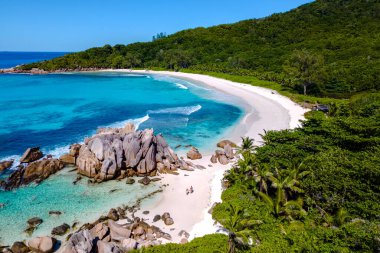 Discover the stunning beauty of Anse Cocos beach in La Digue, Seychelles, where turquoise waters meet soft white sand. This tropical paradise is perfect for relaxing vacations and adventures.