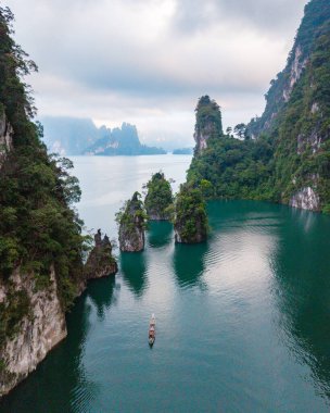 Experience the stunning beauty of Khao Sok National Park Thailand with its lush greenery and tranquil waters.