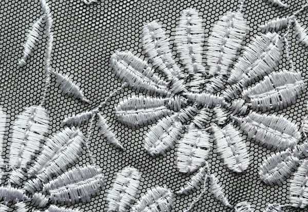 Czarne kwiaty i liście koronki strzał makro materiał z tekstura — Zdjęcie stockowe