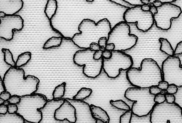 Svarta blommor och blad spetsar material textur makro skott — Stockfoto