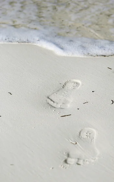 The foot print on the sand at the seashore. — Stock Photo, Image