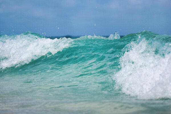 The close up shot of ocean wave with foam