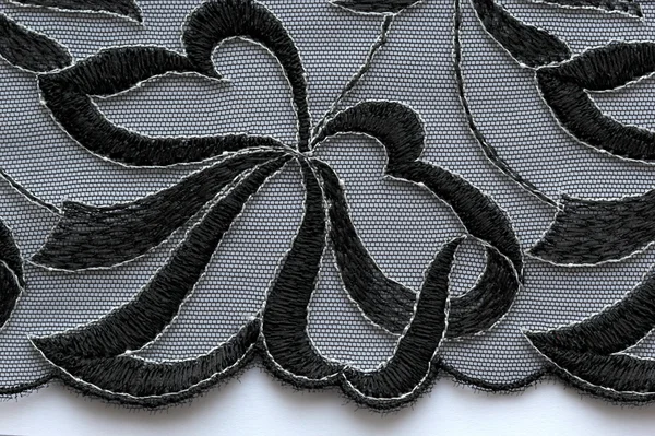 Макроснимок белого и черного кружева текстуры материала — стоковое фото