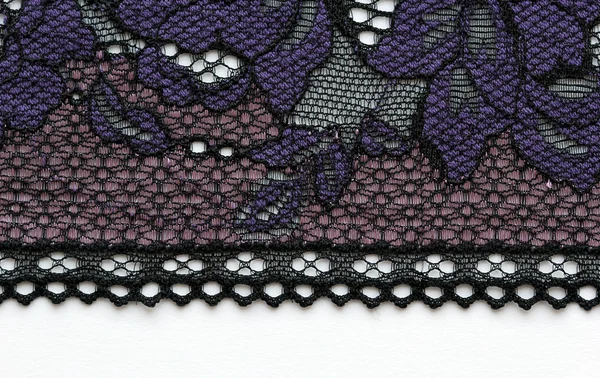 Makro snímek fialové krajky textury materiálu — Stock fotografie