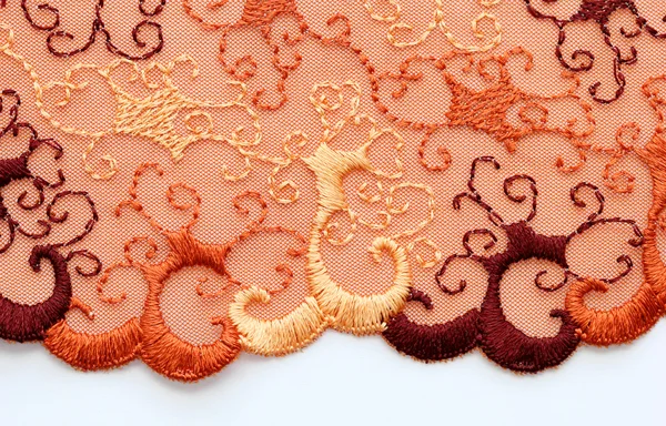 The macro shot of the red and orange lace texture materia — Stock Photo, Image