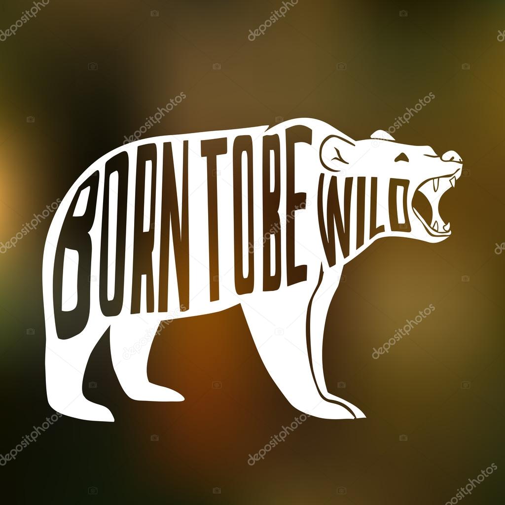 Silhouette of wild bear with text inside on blur background.
