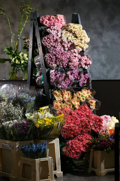 Flowers in the flower store background tulips roses bouquet backdrop online shop