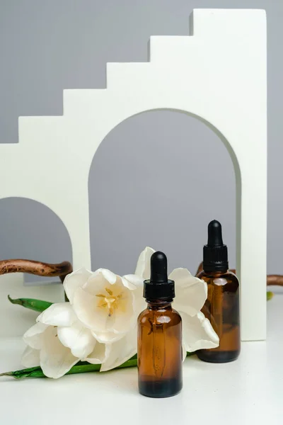 Massage Oils Dark Glass Jar Essence Skin Health Backdrop Arches — Stock Photo, Image