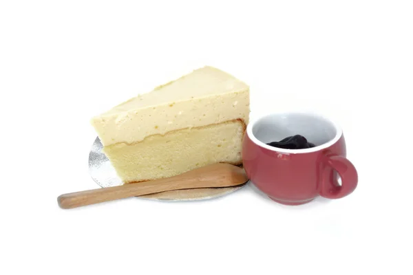 Torta di formaggio su un piatto e salsa di mirtilli in tazza — Foto Stock