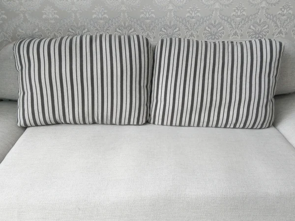 Sofá cinza e travesseiro como fundo de móveis — Fotografia de Stock