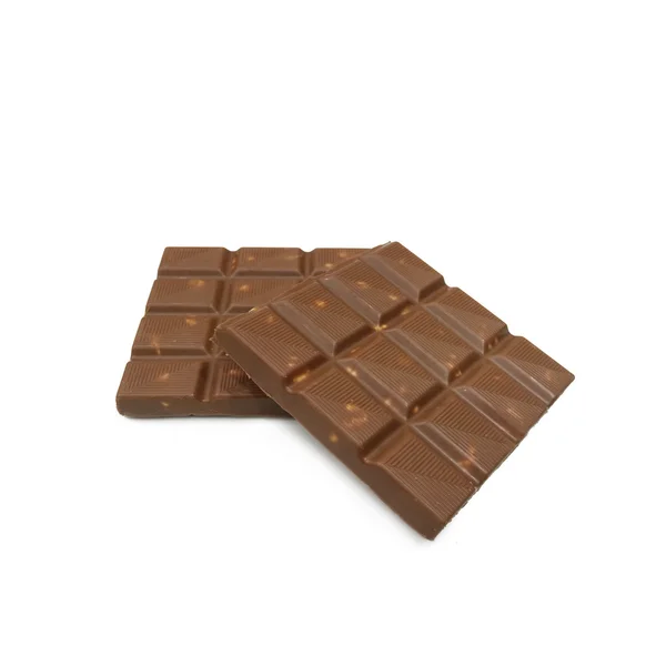 Barras de chocolate con almendras nueces acostadas sobre fondo blanco —  Fotos de Stock