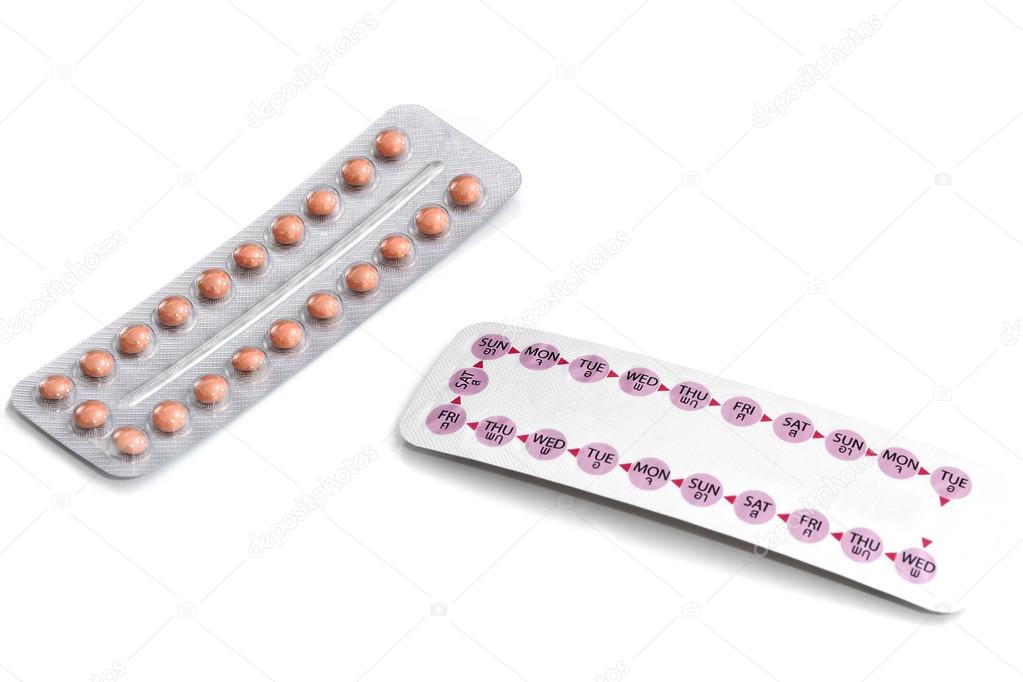 Oral contraceptive pill on white background