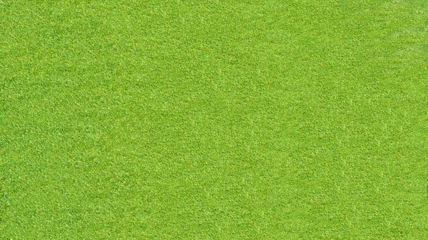 Зеленый фон из искусственной травы — стоковое фото