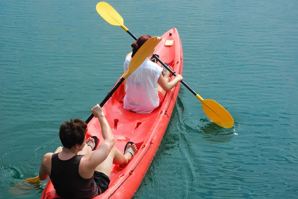 Travelar paddle a kayak on the sea. Kayaking on island