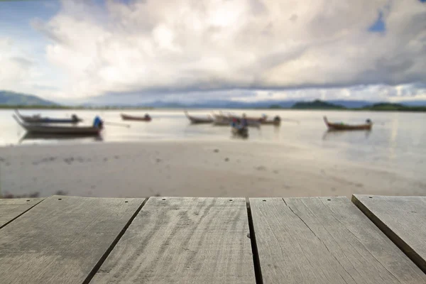 Defocus and blur image of terrace wood and Beautiful beach for background — Stock Photo, Image