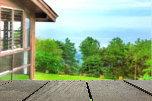 Perspective wood over blur beautiful resort and landscape mountain hill with bokeh background — Stock Photo, Image