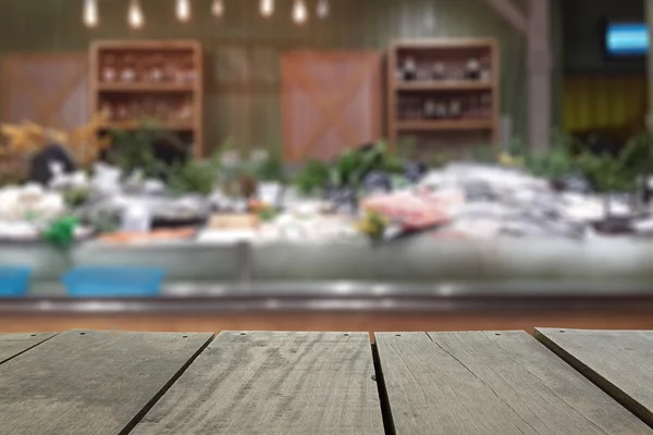 Defocus and blur image of terrace wood and Supermarket blur background in seafood devision for background usage — Stock Photo, Image