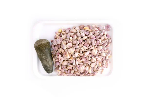 Alho e pilão em prato — Fotografia de Stock